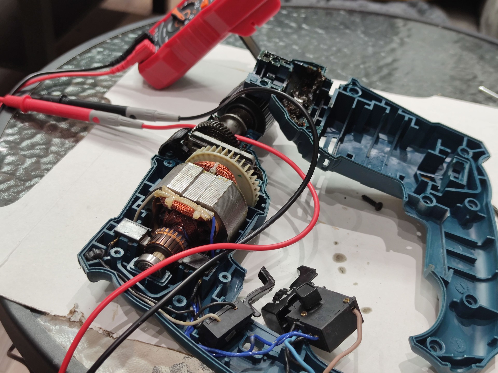 disassembled electric drill motor. repairing a broken electric drill motor. electrical mechanisms repair and maintenance